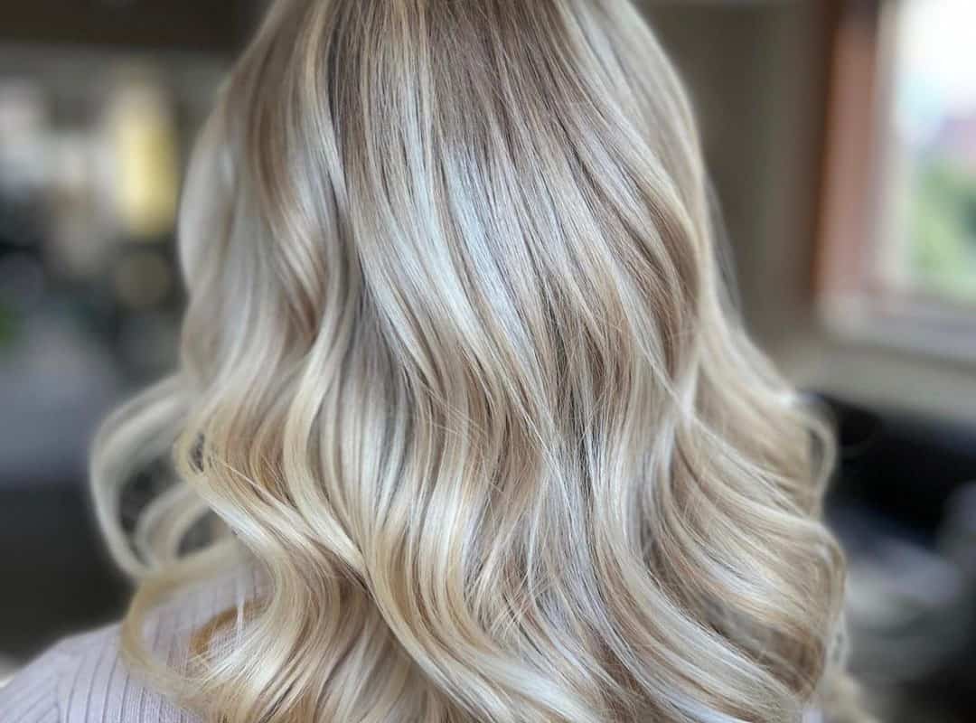 Ash blonde balayage with bangs