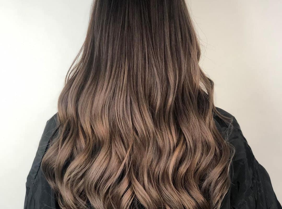 Brown balayage with shiny light brown tips