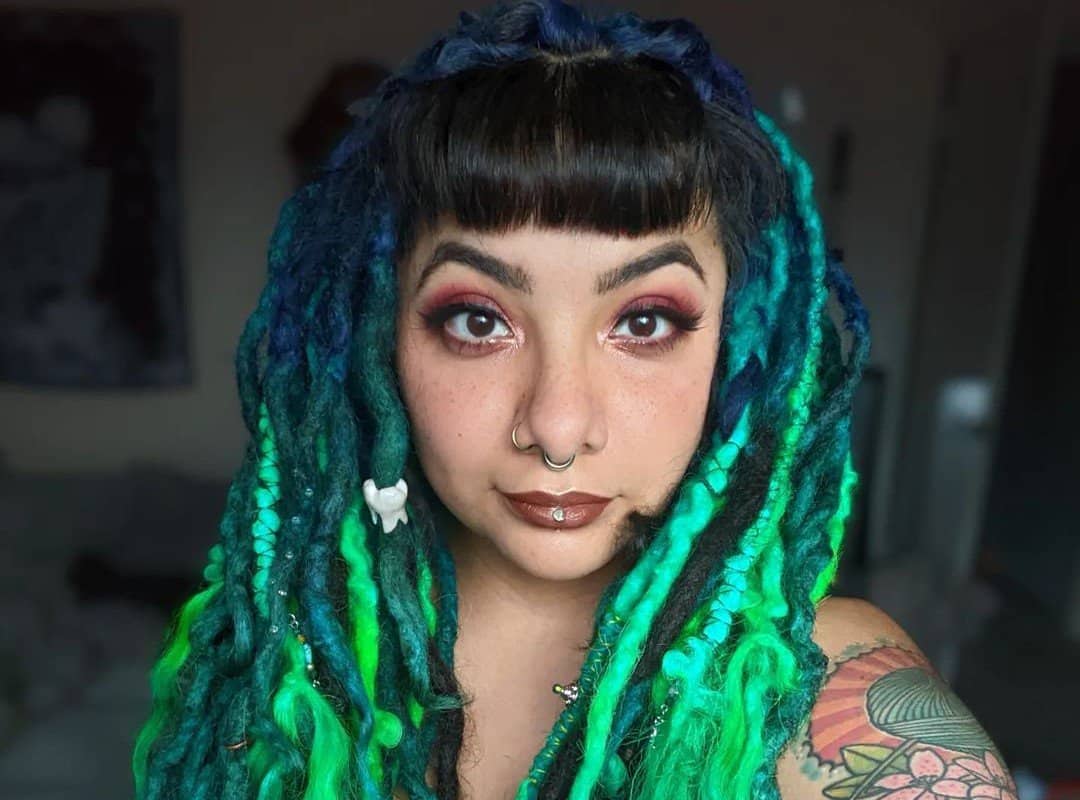 girl with blue and green ombre dyed dreads