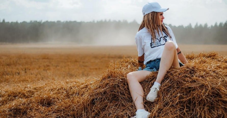 girl in a field with hippie dreads