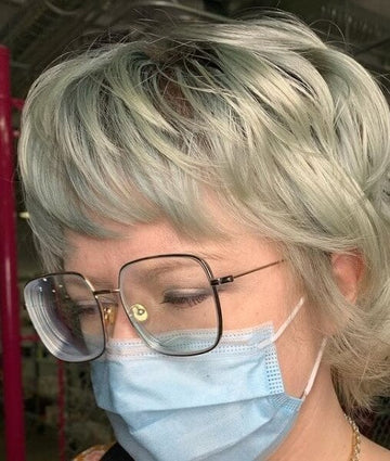 hairstyles for 60-year-old woman with glasses and round face